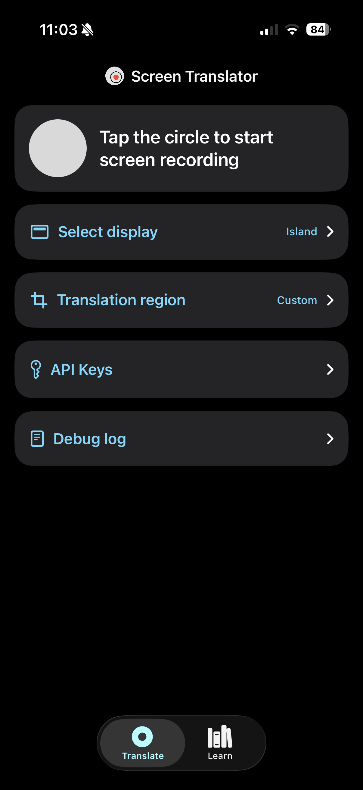 The Translate tab before a session: a card with a gray circle and the words Tap the circle to start screen recording, then rows for Select display set to Island, Translation region set to Custom, API Keys, and Debug log