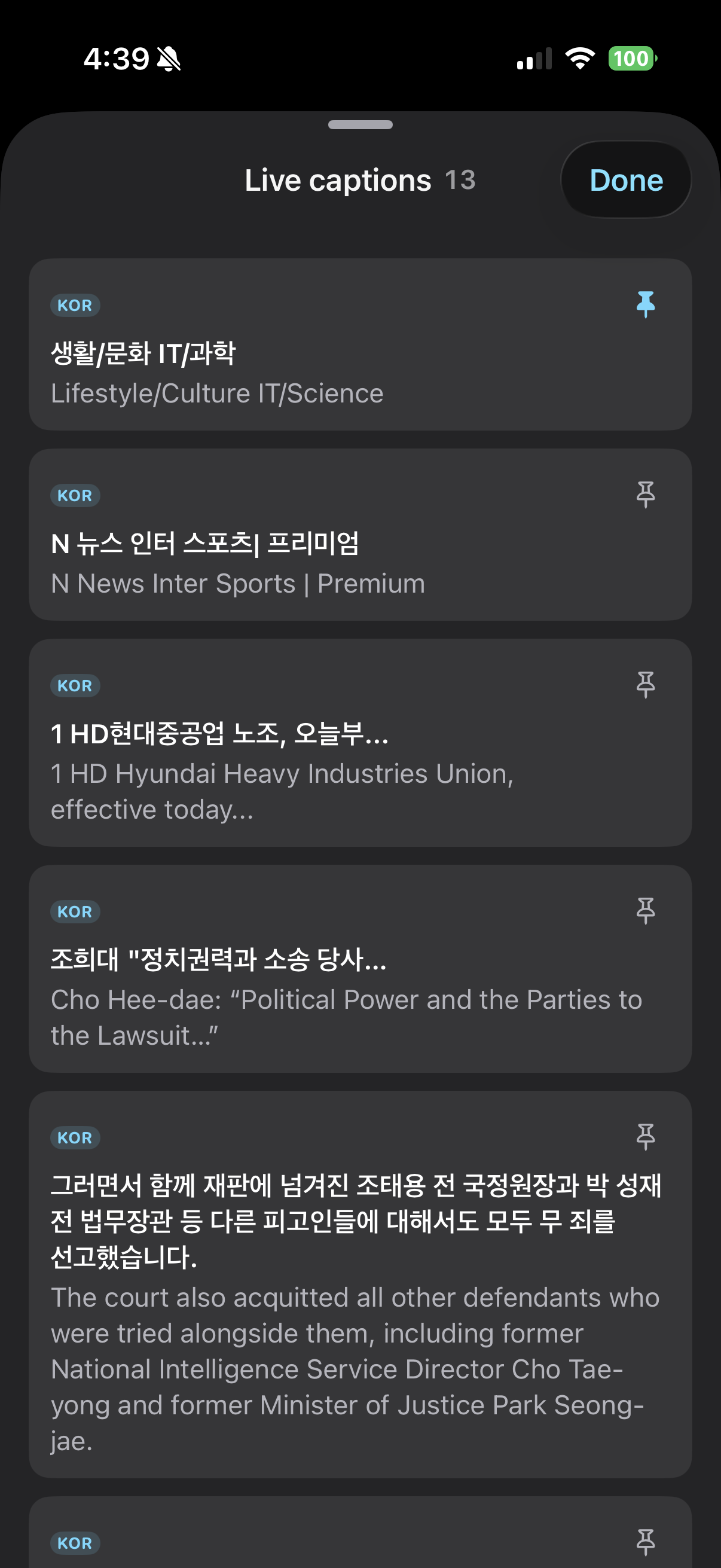The Live captions sheet: a count of thirteen and a Done button, then each caption as a card with its Korean line, its English under it, and a pin at the corner, the first one pinned in blue and the rest hollow